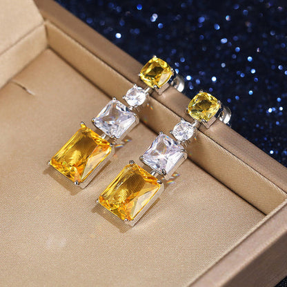 Anti-Tarnish Silver Plated American Diamond Studded Yellow Geometrical Crushed Ice Cut Drop Earrings - Wholesale