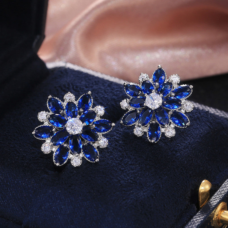 Anti-Tarnish Silver Plated American Diamond Studded Navy Floral Stud Earrings - Wholesale